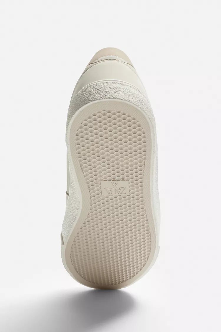 White Basic Sneakers | Zara | Retro trainers. Mixed-material upper. Six-eyelet facing. Flat, textured sole.| RAW | LUXURY EMPORIUM